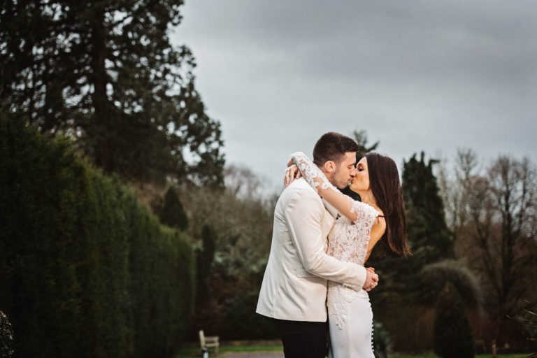 Bride and groom kiss.