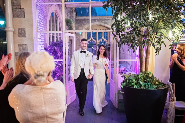 Bride and groom make their entrance, at Tortworth Court.