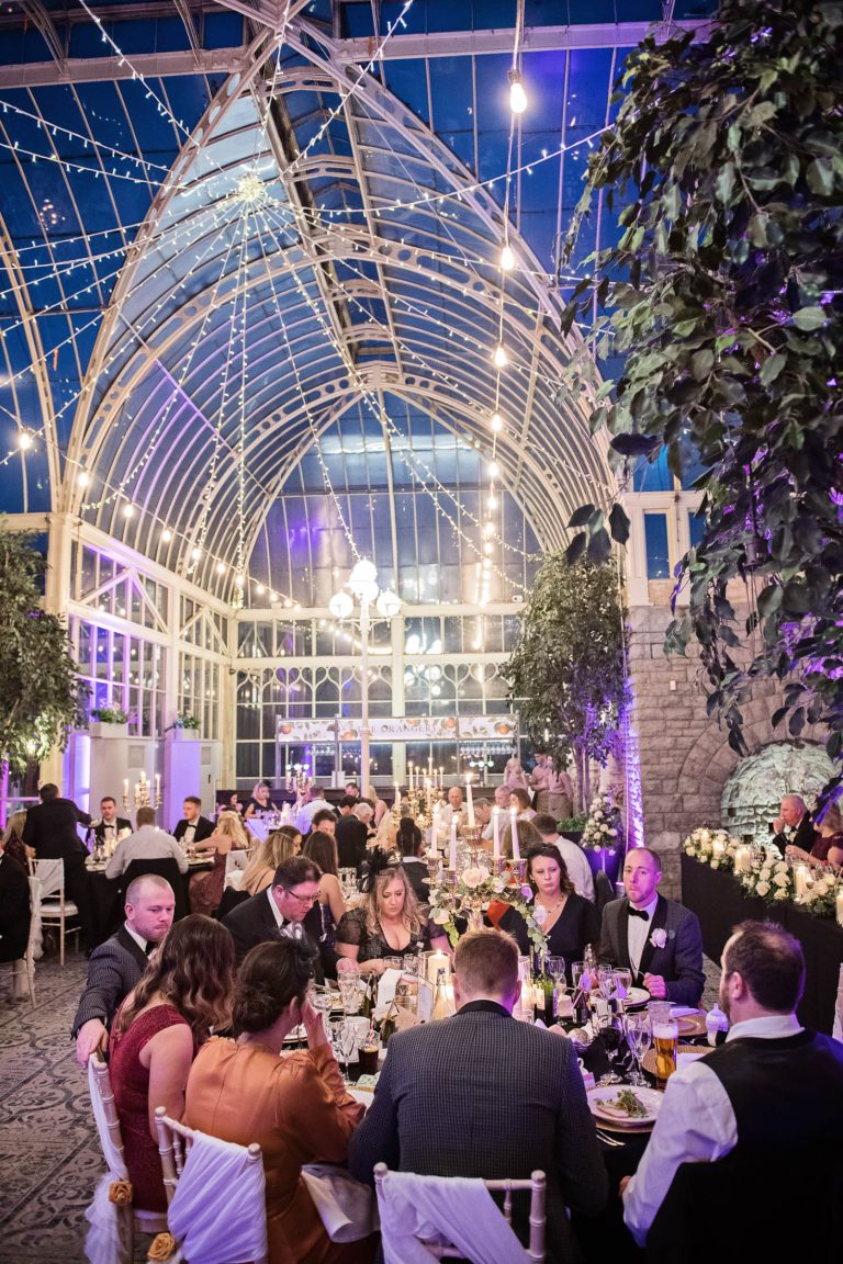 Portrait photo of wedding breakfast in full swing at the Tortworth Court Hotel during a winter wedding.
