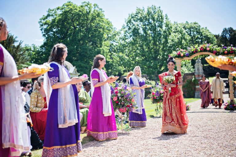 Bridal entrance at North Mymms Park, outdoor ceremony, candidly photographed by Blooming Photography. Colourful.