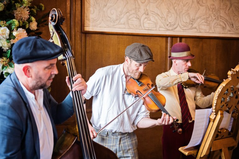 Musicians play at North Mymms Park, candidly photographed by Blooming Photography.