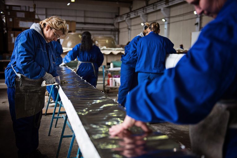 Workers creating an expansion joint in a engineering factory in Romania.