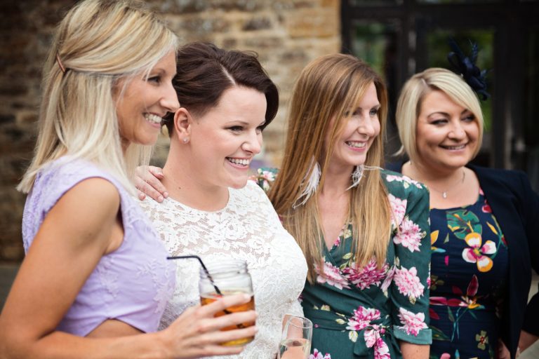 Candid photograph of guests smiling and laughing.