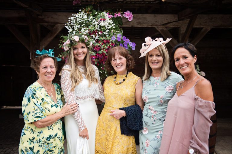 Photo of bride, her mum and her sisters, colourful.