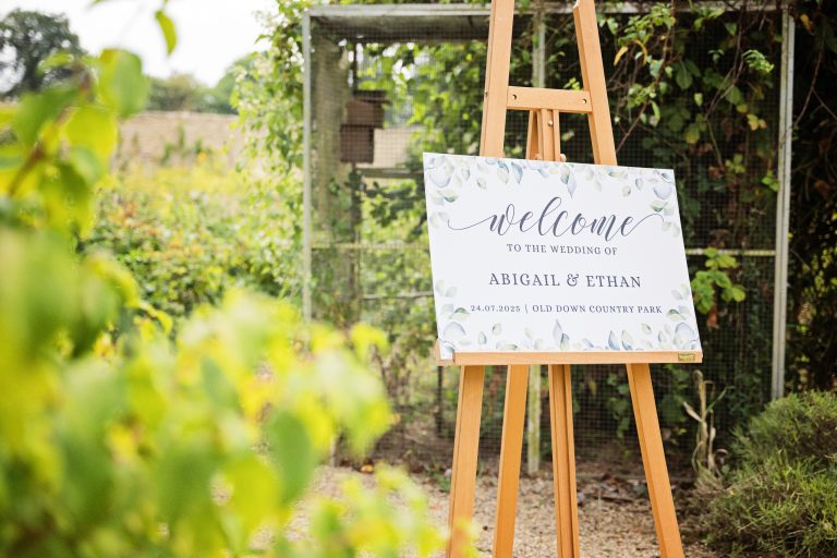 a wedding sign welcoming people to Abigail and Ethan's wedding at Old Down Country Park