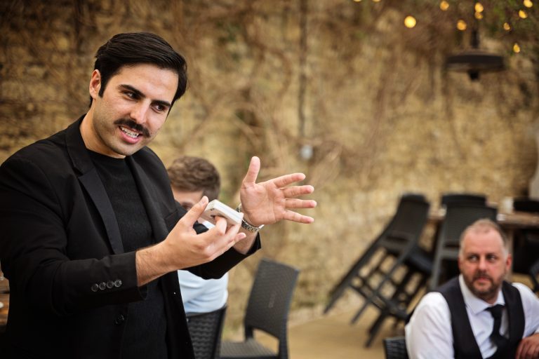 A magician entertaining wedding guests