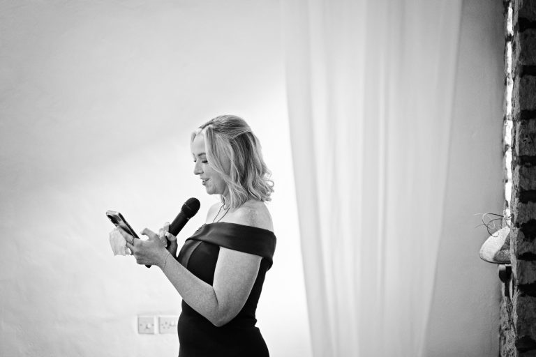 b & w image of maid of honour doing a speech
