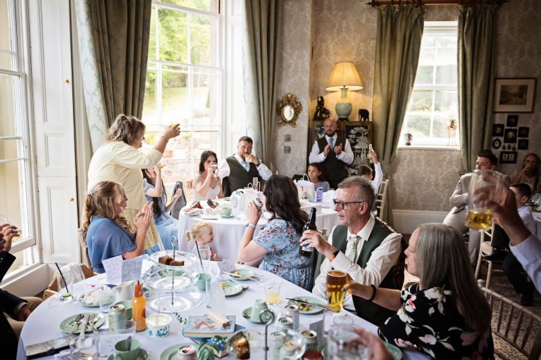 Homme House's dining room full of wedding guests listening to the speeches.