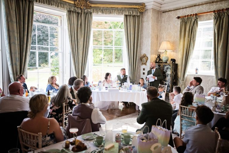 Homme House's Georgian dining room full of wedding guests listening to the speeches.