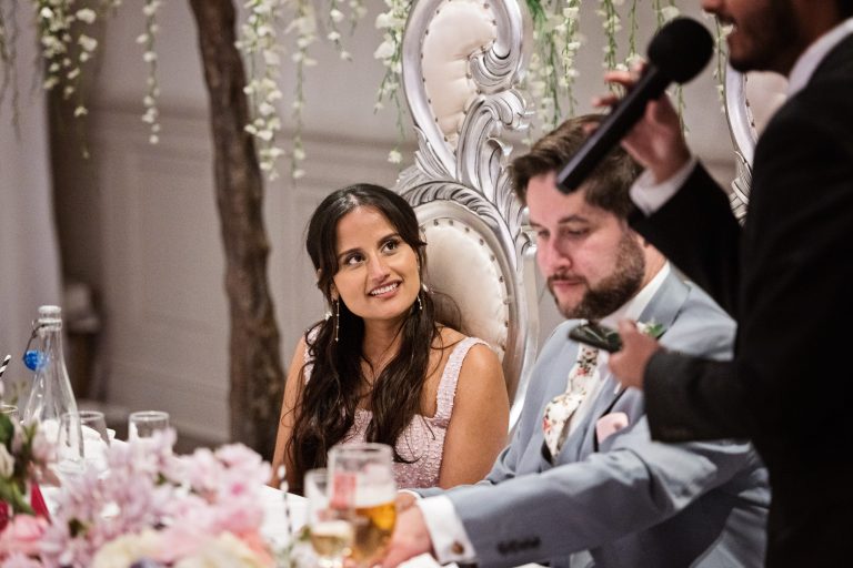 Candid wedding photo at Manor By The Lake by Blooming Photography