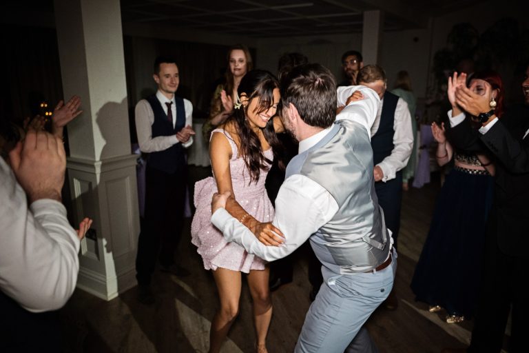 Fun first dance at Manor By The Lake by Blooming Photography