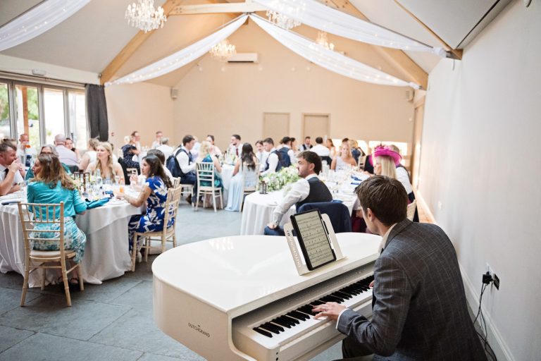 A pianist playing during wedding breakfast.