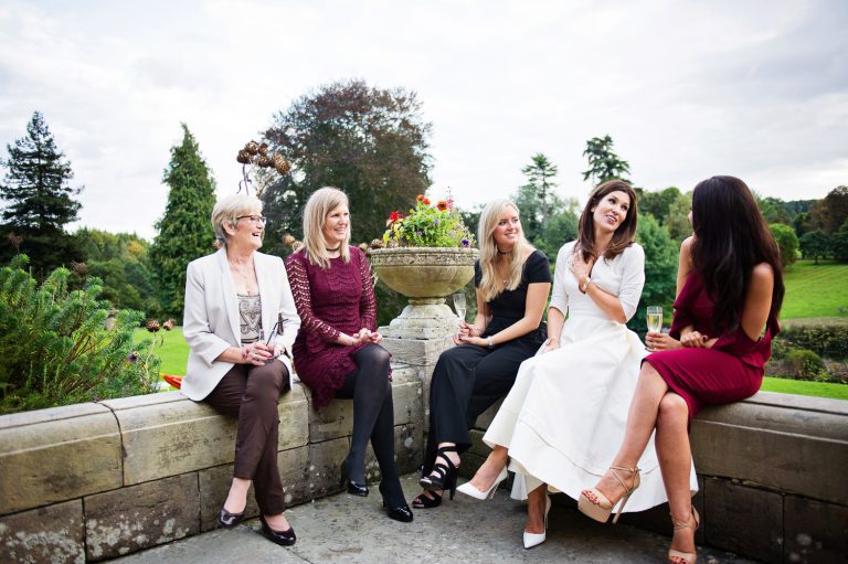 Candid moment of bride chatting to her friends.