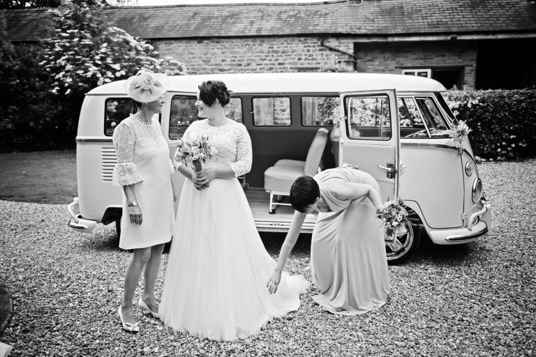 Bride and her mum and her bridesmaid in front of a VW split screen at Dodmoor House
