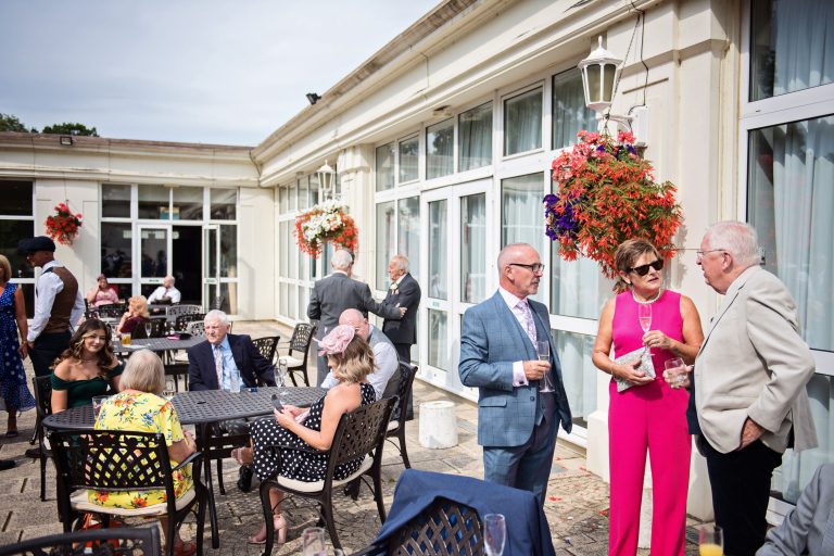 Wedding guests chat outdoors at Double Tree.