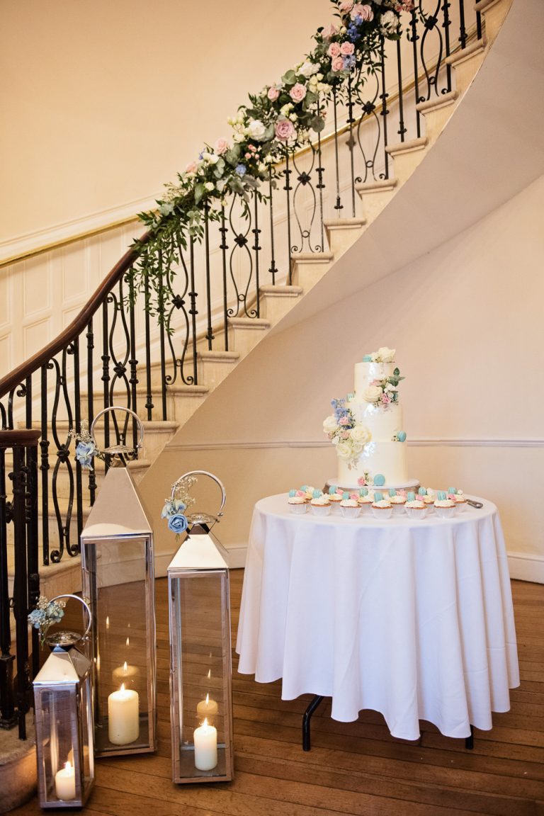 Wedding cake at the bottom of the spiral staircase at Eastington Park.