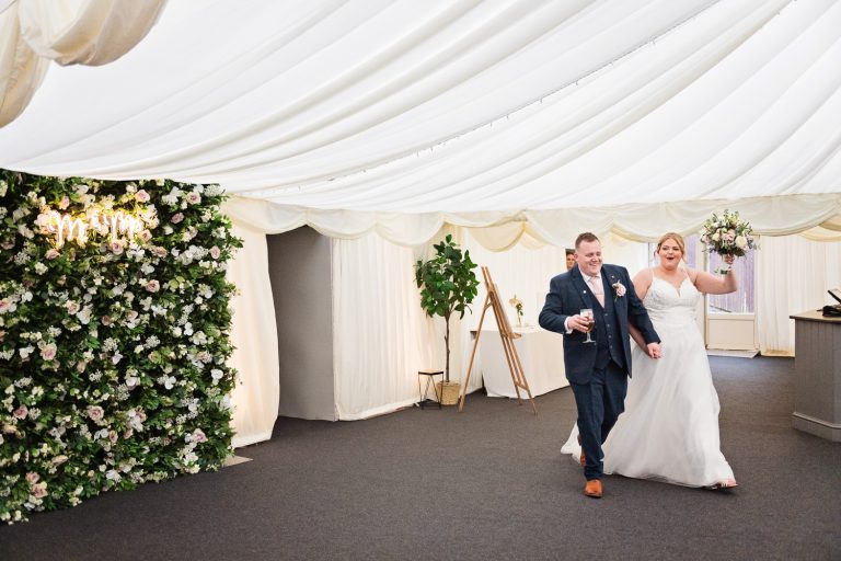 Bride and groom enter the marquee