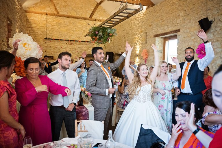 Bride and groom and their guests enjoying the party.
