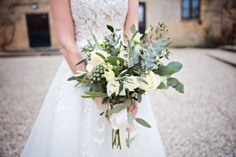 Wedding bouquet. Bride holding it.