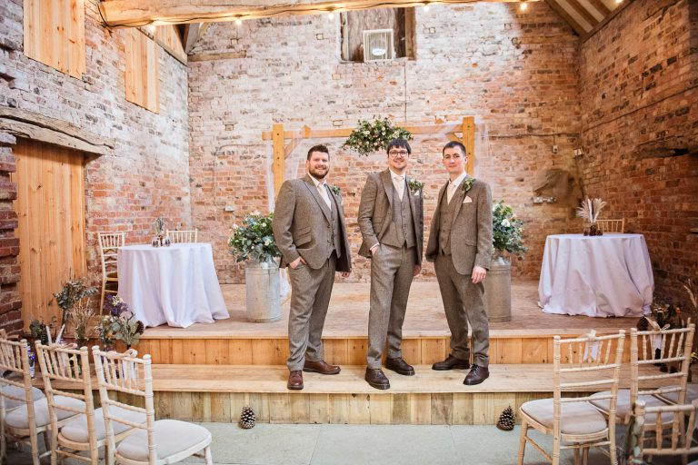 Groom and his best men at the front of the stage at Milton End Farm.