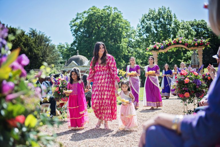 Flower girls and bridesmaids arriving for the Hindu ceremony.