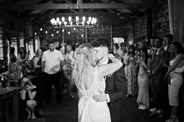Bride and groom on the dance floor. B&W photo.