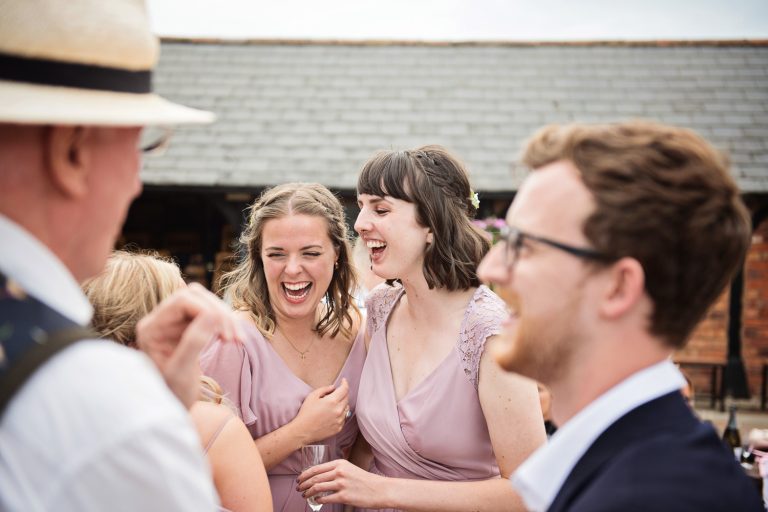 Documentary photo of friends and bridesmaids enjoying themselves.