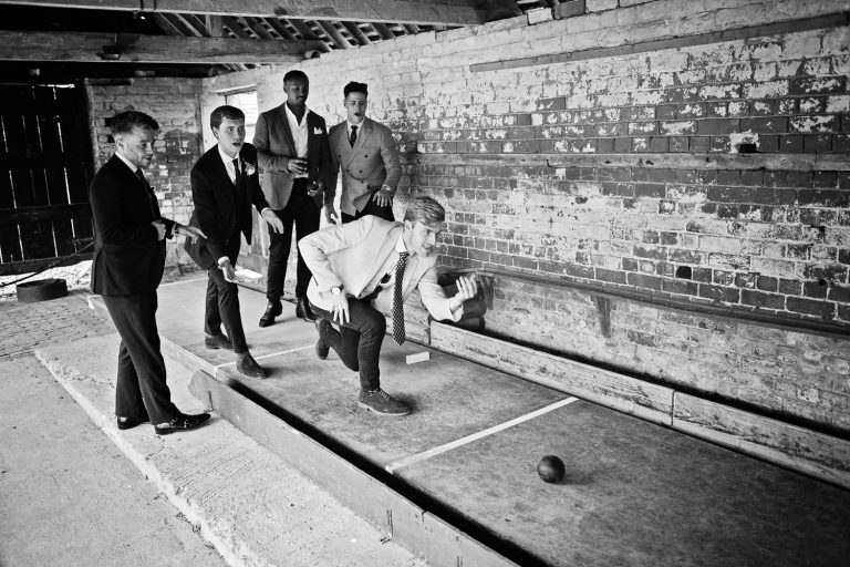 People playing skittles. B&W photo.