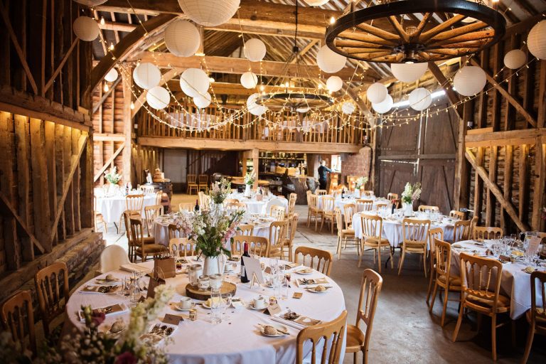 Rustic Wedding breakfast layout in a wedding barn in Gloucestershire.