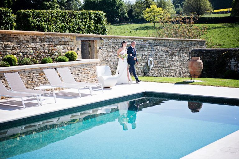 Storytelling image of Bride and her father making the entrance to the wedding at Temple Guiting Manor