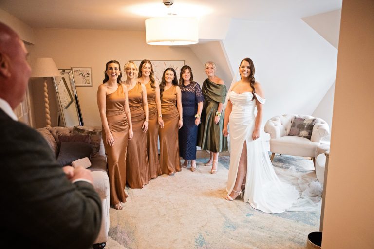 Dad seeing the bride in her wedding dress for the first time.
