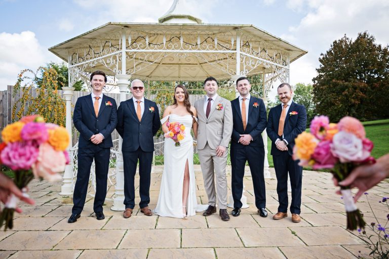Fun formalish photo of the bride and groom with the groomsmen at The Pear Tree, Purton.