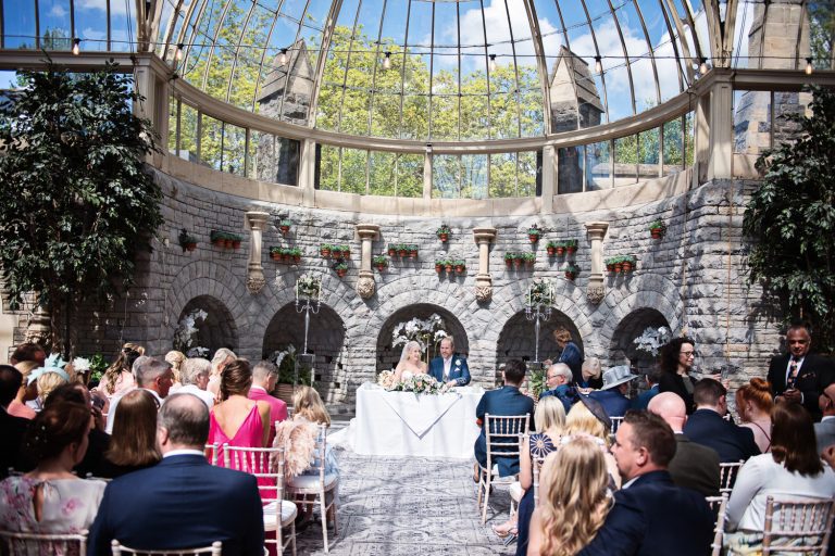 Bride and groom sign their wedding register.