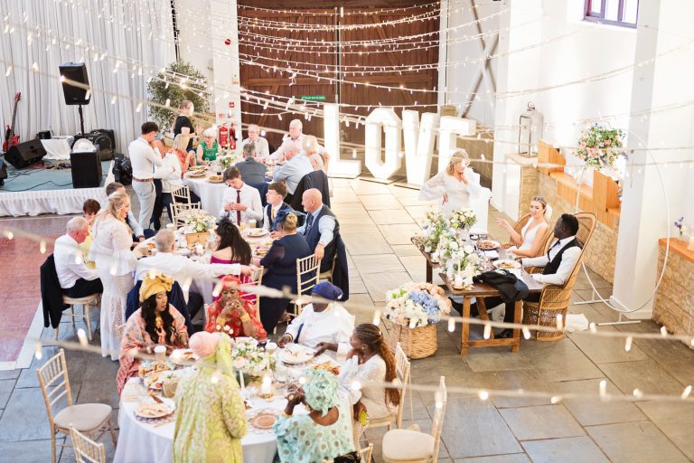 Overview of a wedding breakfast in full flow at Worton Hall.