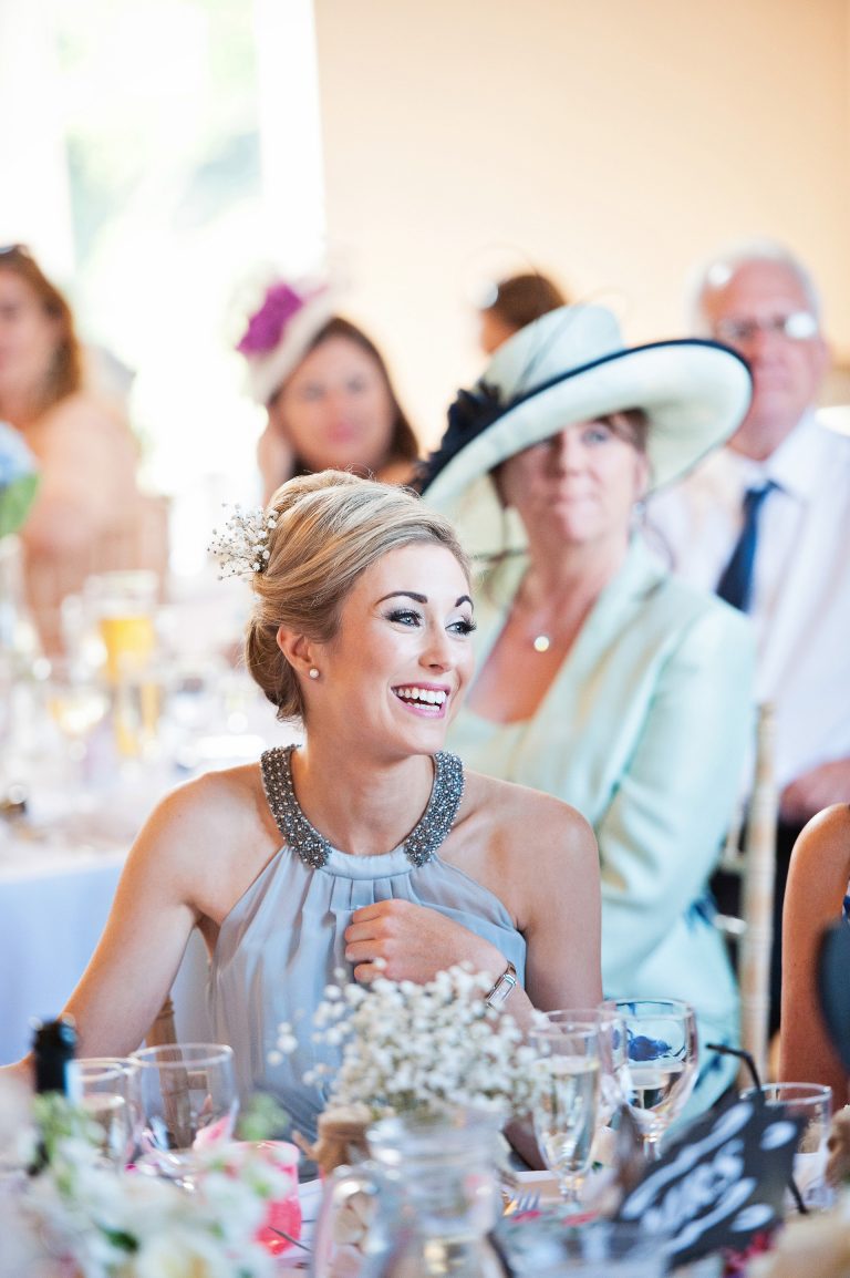 Portrait photo of wedding guests during speeches.