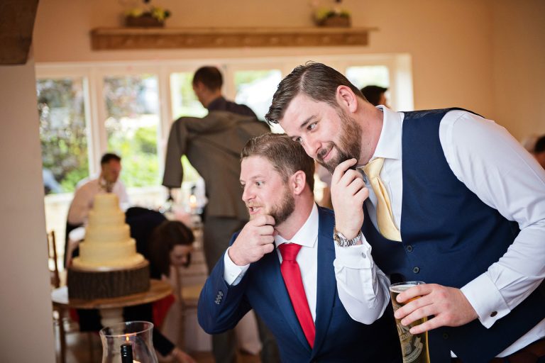 Fun candid pic of wedding guests pulling faces.