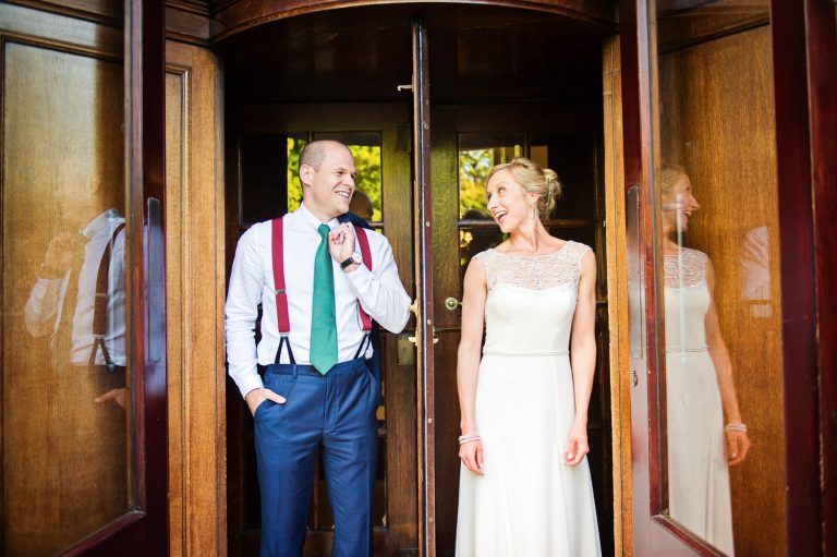 Bride and groom in the infamous door at the Queens Hotel.