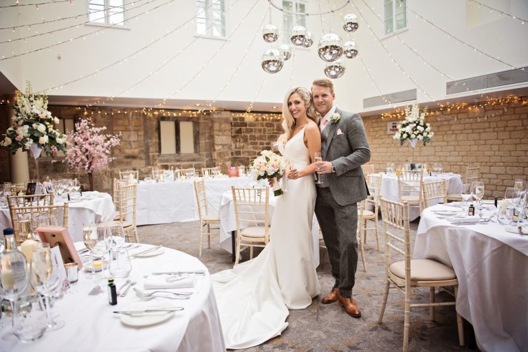 Bride and groom in the wedding breakfast suite at Ellenborough Park.