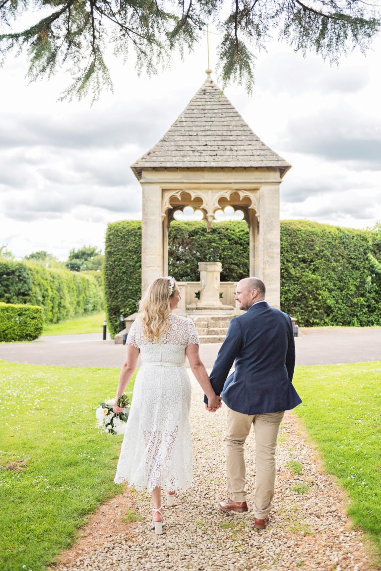 Ellenbourough Park wedding couple walking away.