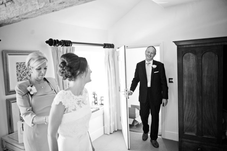 Father of the bride entering the room to see his daughter for the first time.
