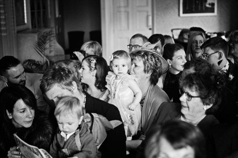 B&W candid photo of child at wedding.