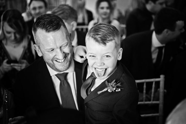 Candid photo of child waiting for the wedding to start at The Slaughters Country Inn