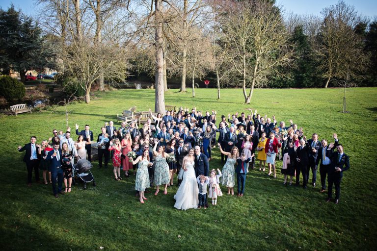 Big group shot of wedding guests at The Slaughters Country Inn