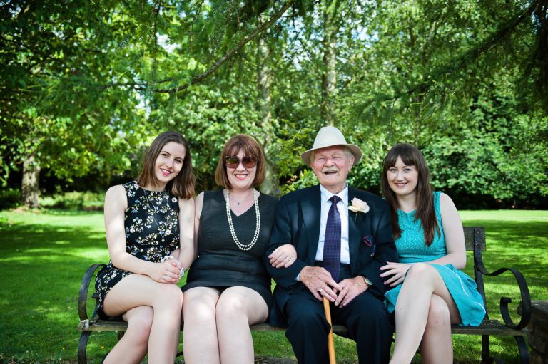 Candid photo of wedding guests at The Slaughters Country Inn in Lower Slaughter.