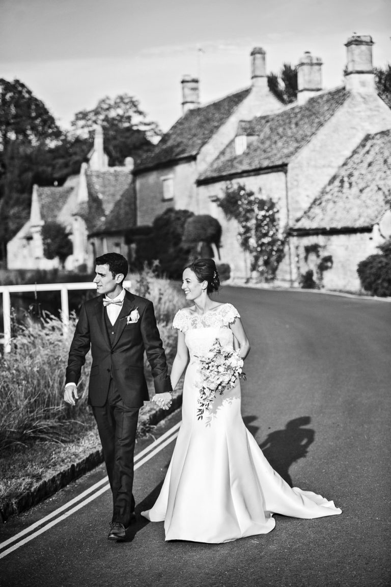 Bride and groom at their wedding at The Slaughters Country Inn (B&W image).