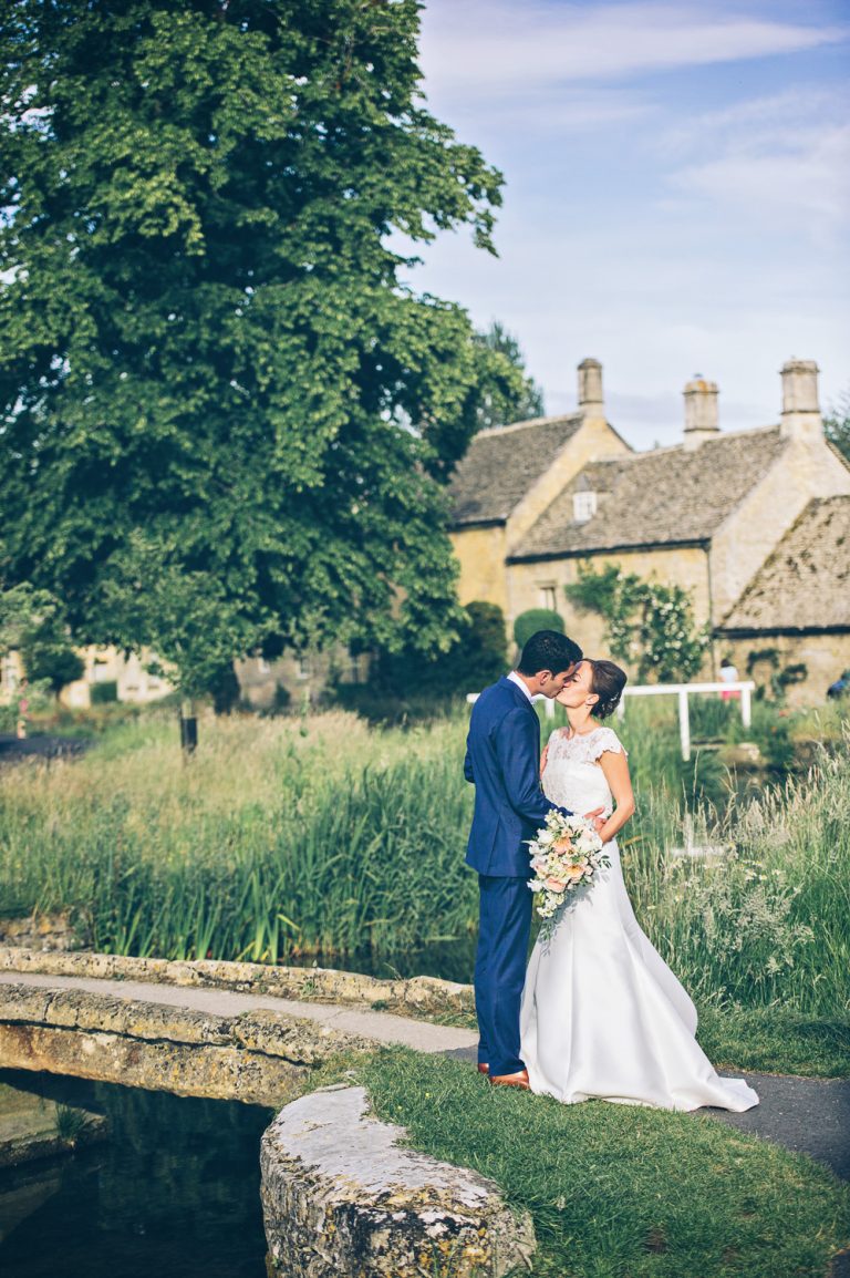 Bride and groom at their wedding at The Slaughters Country Inn in Lower Slaughter.