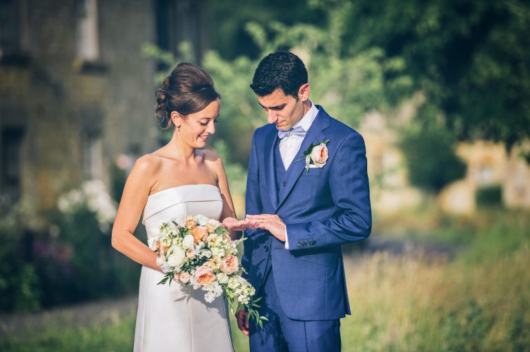 Bride and groom check out their wedding rings.