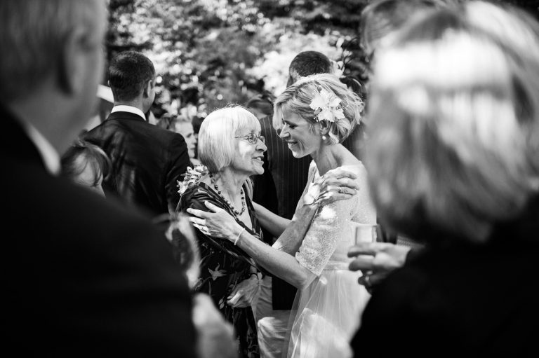 Natural moments captured candidly between bride and her family.