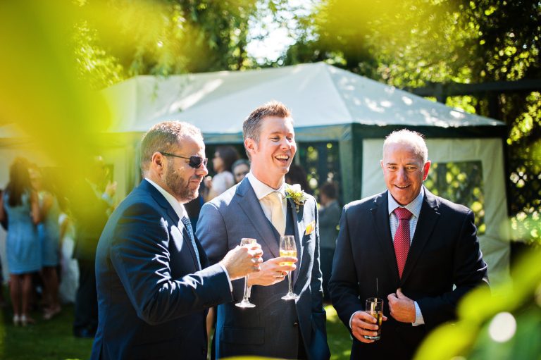 Candid photo of groom and his friends.