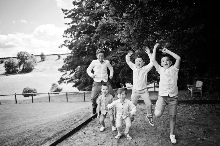 Fun image of children jumping. B&W.